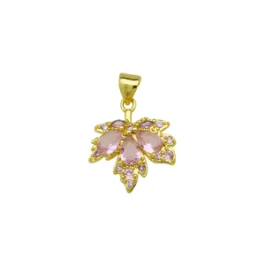 Detailed view of gold plated pink zircon maple leaf pendant, elegant jewelry accessory.