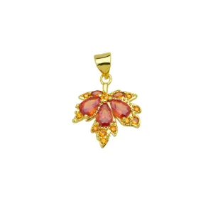 Exquisite gold plated maple leaf pendant featuring sparkling colorful cubic zirconia stones.
