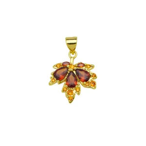 Exquisite detail shot of red and yellow cubic zirconia maple leaf gold plated pendant necklace.