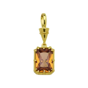 Detailed close-up of a rectangular colored cubic zirconia pendant in 18k gold plated copper.