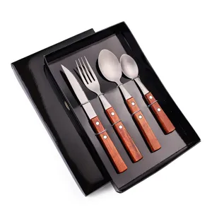 Stainless steel steak knife fork and spoon 4-piece set with wooden handle in gift box.