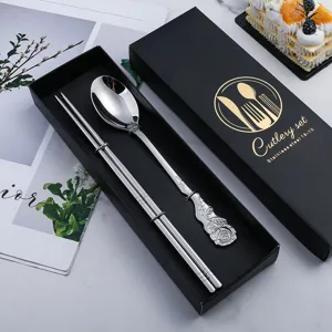 Luxury stainless steel cutlery set with elegant rose relief spoon and chopsticks in gift box.