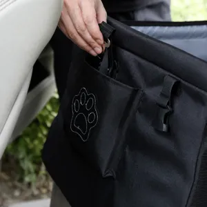 Close-up detail of the black pet car bag showing durable fabric and front pocket storage.