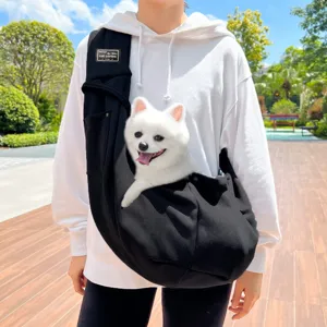 Comfortable black pet sling bag for small dogs and cats, portable outdoor pet carrier for travel.