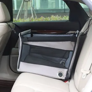 Detailed shot of grey pet car seat showing breathable mesh and durable fabric material inside car.