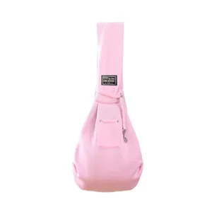 Detailed view of the pink pet sling carrier strap and pocket, soft fabric design for outdoor.