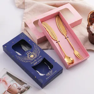Coffret cadeau cuillère et fourchette plume en acier inox, design aile créatif.