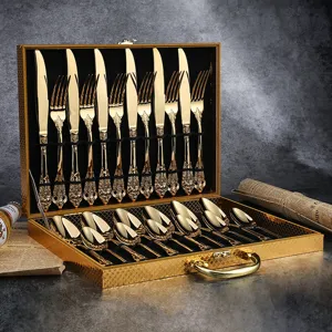 Luxury gold stainless steel cutlery set with vintage embossed handles in a storage gift box.
