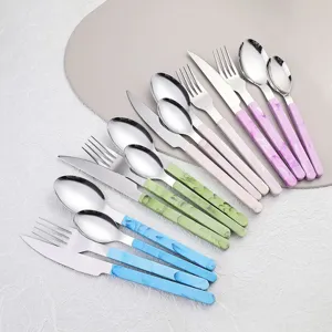Stainless steel flatware set with colorful marble pattern handles, elegant western knife fork spoon