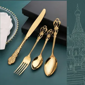 Set de couverts en acier inoxydable doré de luxe avec poignée en relief vintage.