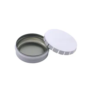 White round metal tin box detail, empty mini container for mints, lip balm and small items.