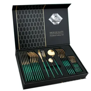 Stainless steel cutlery set with gold finish and green handles in a luxury gift box.