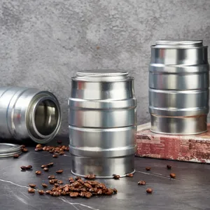 Detailed close-up view of silver metal coffee tea storage tin jar, industrial barrel design.