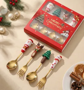 Set di cucchiai e forchette da dessert di Natale in acciaio inox con manici in silicone rosso.