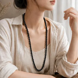 Elegant black obsidian round bead necklace for women, classic long beaded jewelry main view.