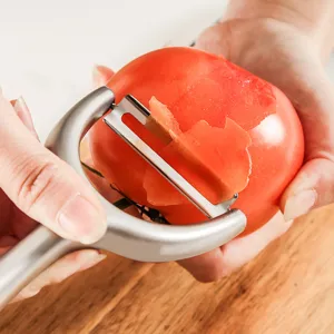 Stainless steel kitchen fruit and vegetable peeler, ergonomic double-blade potato peeler tool.