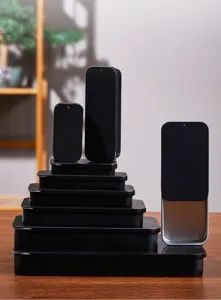 Detail view of black sliding metal storage tin boxes, sleek minimalist design for daily use.