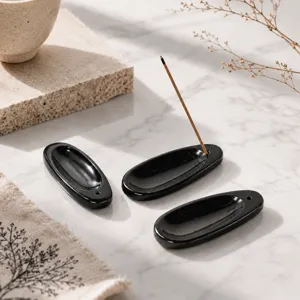 Natürlicher Kristall Stein Weihrauchhalter Set, elegante schwarze ovale Räucherstäbchen.