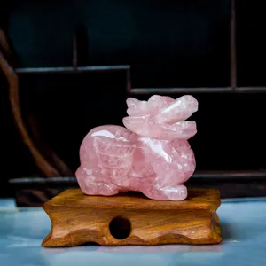Rose quartz Pixiu crystal carving ornament with wooden base for home decor and lucky gift.