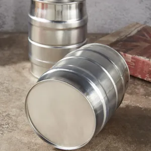 Detail shot of metal barrel storage tin for coffee beans and food, vintage style silver container.