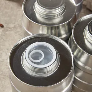 Detailed close-up of metal sealed storage jar, showing threaded opening and inner pull-ring lid.