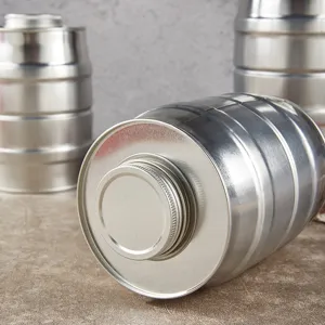 Detail view of stainless steel storage canister with metallic texture and screw lid for food.