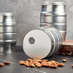 Stainless steel coffee bean storage canister with exhaust valve, metallic finish detail shot.