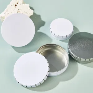 Round metal tin boxes for lip balm candy and pills, detailed view of compact storage containers.