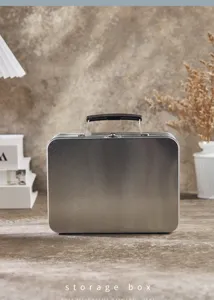 Metal storage tin box with handle and clasp for lunch, stationery and small items.