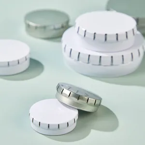 Round metal tin boxes detail view, perfect containers for lip balm, cosmetics, and small pills.