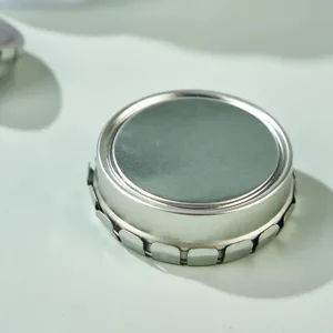 Round small metal tin box, press-type empty container for lip balm, ointment, mints, and pills.