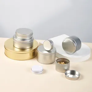 Metal tinplate storage cans set, round metal containers for small items, craft display detail.