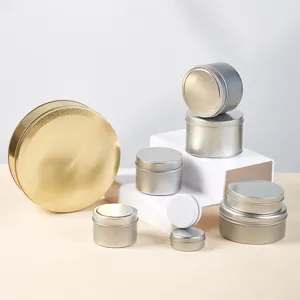 Round metal tin containers detail view, various sizes of silver and gold storage cans for crafts.