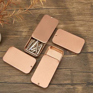 Boîte de rangement coulissante en métal or rose petits contenants pour pilules et petits objets.
