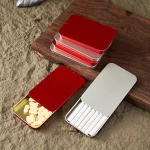Portable metal slider tin box for pills and small items, red and silver pocket storage case.