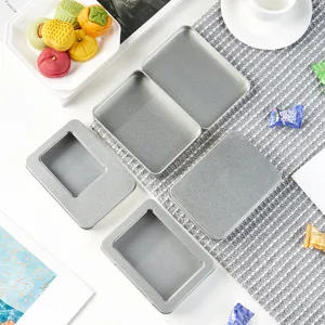 Silver metal tin storage box with clear window, rectangle tinplate container for small items.