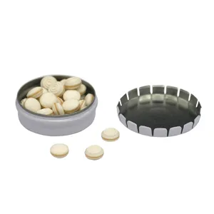 Miniature round tin box with press lid, empty metal storage container for mints or small items.
