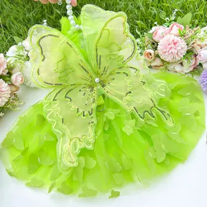Green lace butterfly pet dress detail, fluffy mesh skirt with elegant pearls and vibrant tone.