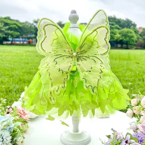 Green fairy pet dress detail featuring sparkling sequin butterfly wings and soft tulle layers.