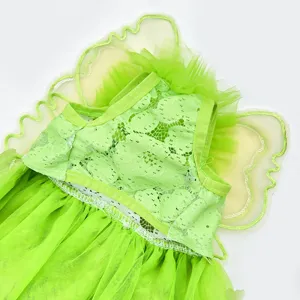 Green pet dress close-up showing delicate lace fabric, layered mesh skirt and fairy wings.