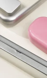 Portable travel flip-top tin storage box for cosmetics, jewelry, stationery and small items.
