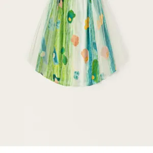 Close-up detail of kids artistic graffiti printed mesh dress or romper overlay, colorful.
