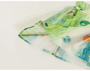 Cute toddler summer dress with artistic graffiti print and delicate mesh tulle overlay detail.