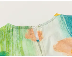 Kids summer apparel back collar button detail close-up colorful abstract graffiti fabric