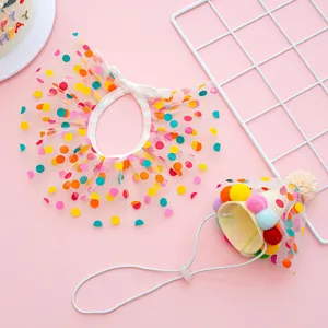 Pet birthday party costume set with polka dot mesh bib and colorful pom pom cone hat.