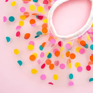 Detailed view of cute pet polka dot mesh bib with colorful dots and white collar trim.