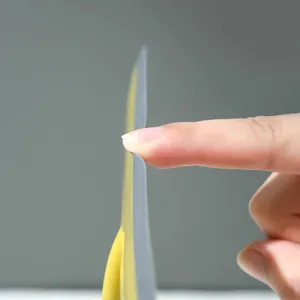 Mini silicone squeegee for bathroom countertop and glass cleaning, flexible and durable design.