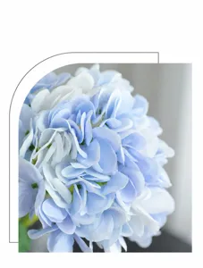 Artificial hydrangea flower head detail shot, realistic touch and soft blue color for decor.
