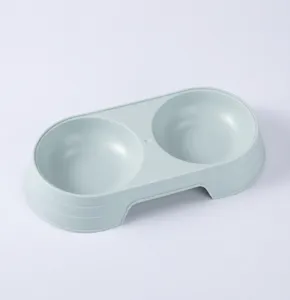 Detail view of the macaron color plastic pet double bowl, ideal for feeding cats and dogs safely.