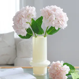 Artificial pink hydrangea flowers in glass vase luxury home decor floral arrangement